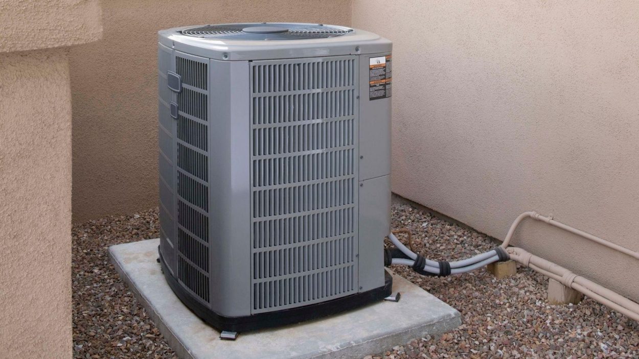 Exterior view of a Trane AC unit on a concrete pad. Consider Trane models for your home in Atlanta, GA.