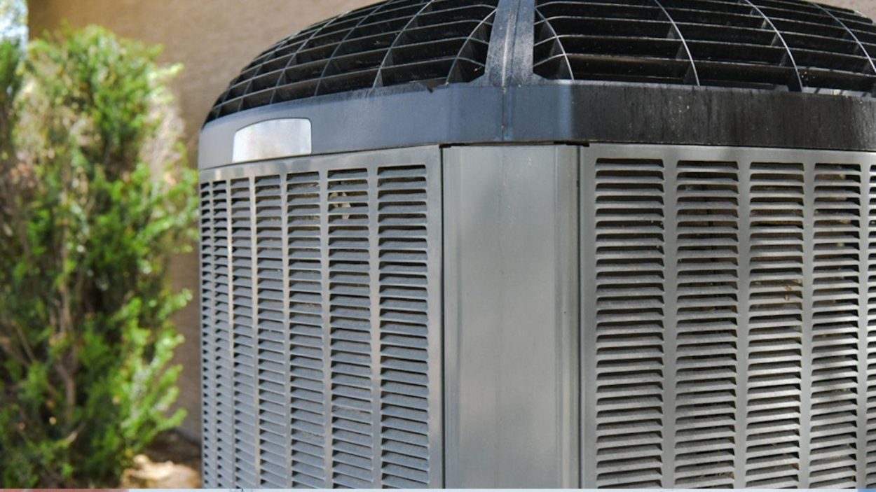Close-up of an AC unit, showcasing its vents and metal exterior. Consider AC repair services in Atlanta, GA for efficient cooling solutions.