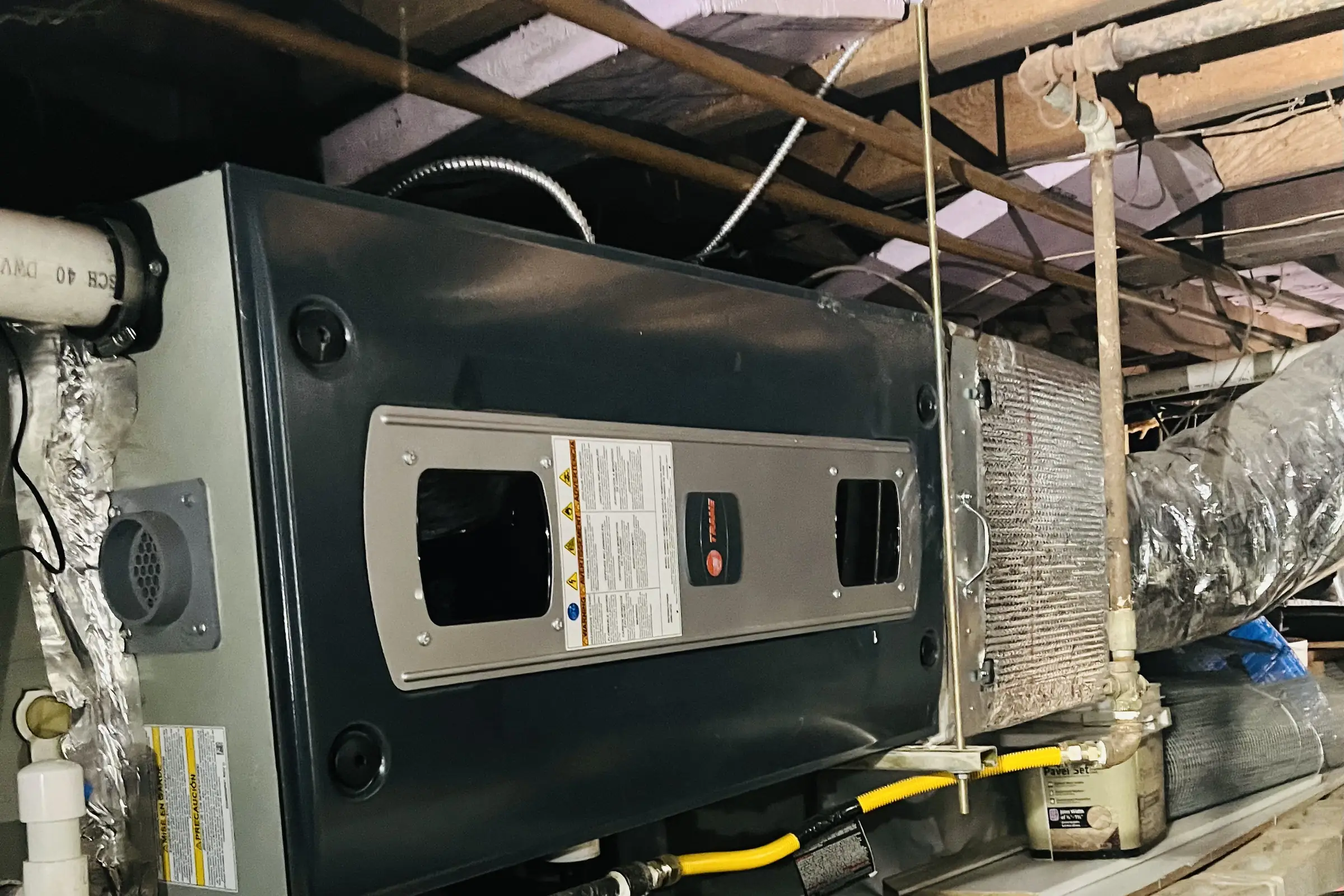 An air handler cabinet installed in an Atlanta attic
