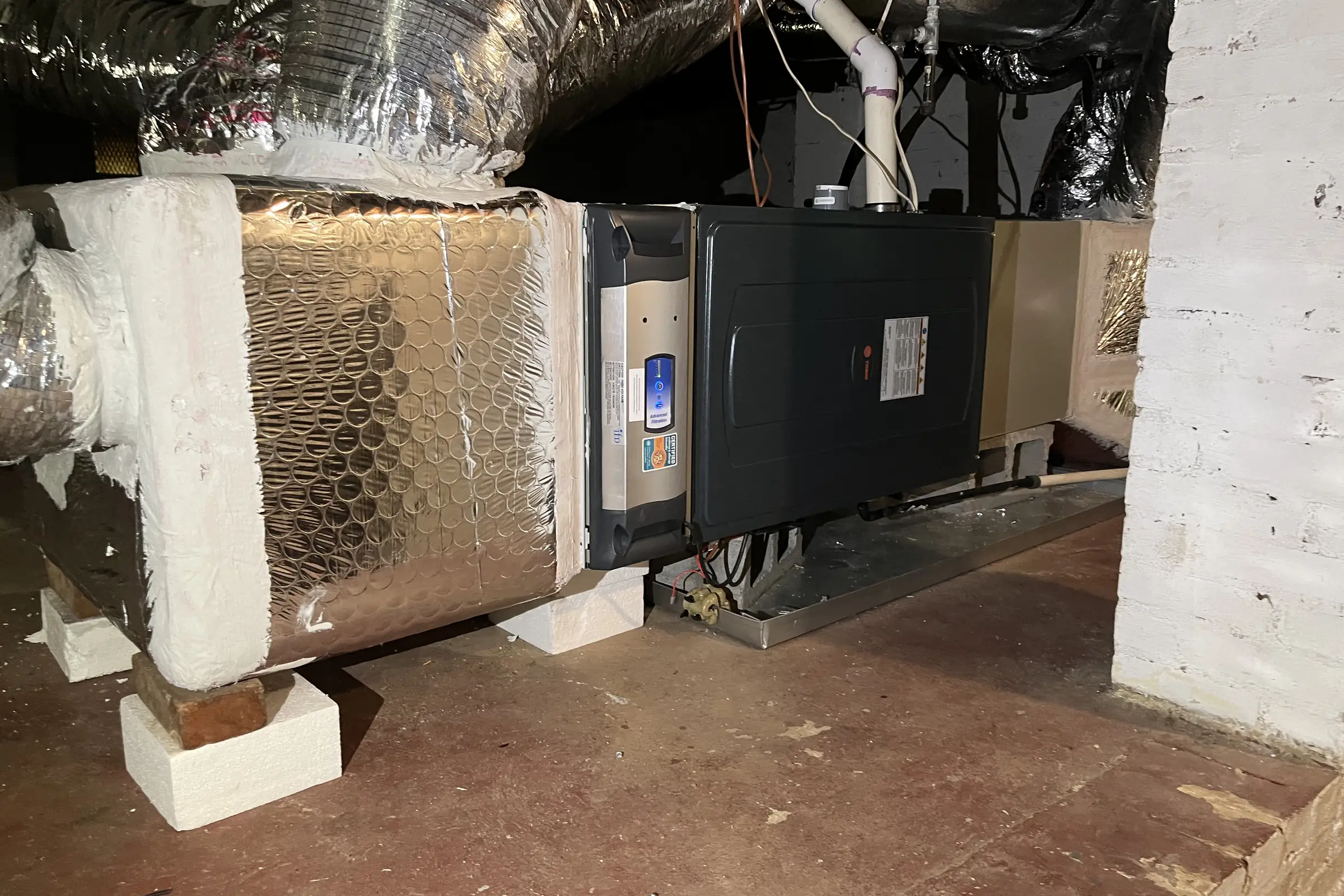 Insulated duct runs feeding separate zones in an Atlanta attic