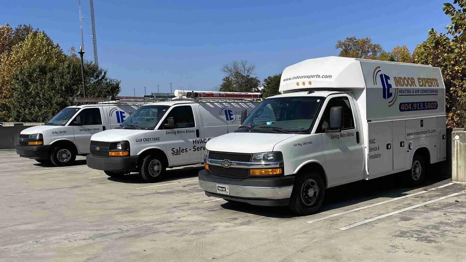 Indoor Experts service vans lined up ready for the day